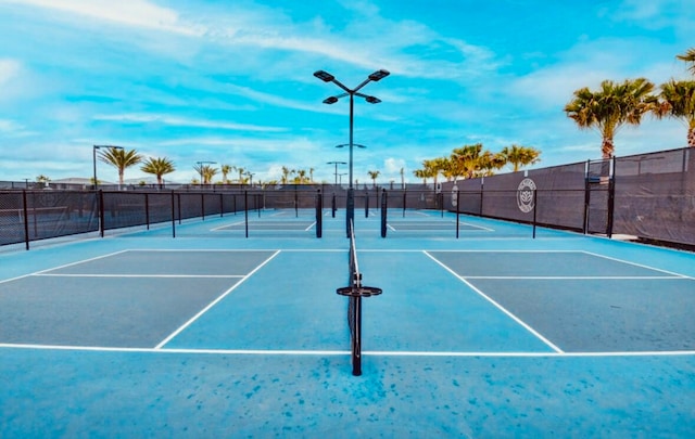 view of sport court featuring basketball hoop