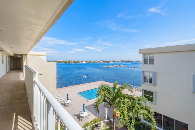 balcony featuring a water view