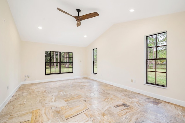 unfurnished room with ceiling fan and vaulted ceiling