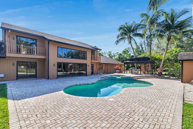 view of pool featuring a gazebo, an in ground hot tub, and a patio