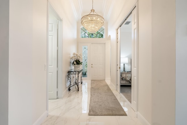 entryway featuring an inviting chandelier