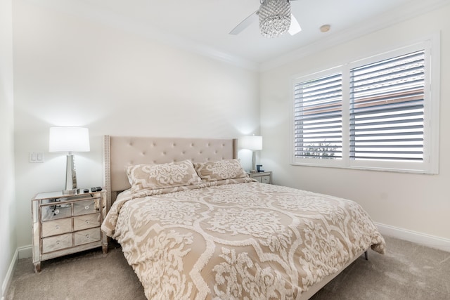 carpeted bedroom featuring ceiling fan and ornamental molding