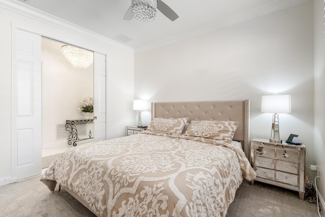 bedroom with carpet, ceiling fan, and ornamental molding