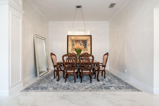 dining room with a chandelier and crown molding