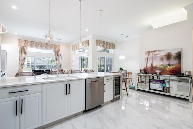 kitchen with crown molding, sink, wine cooler, stainless steel dishwasher, and decorative light fixtures