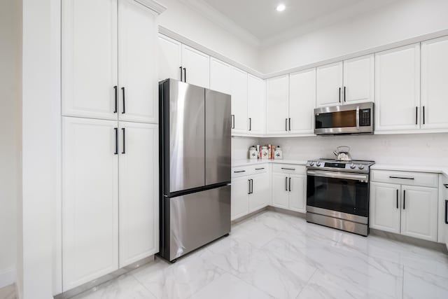 kitchen featuring white cabinetry, crown molding, and appliances with stainless steel finishes