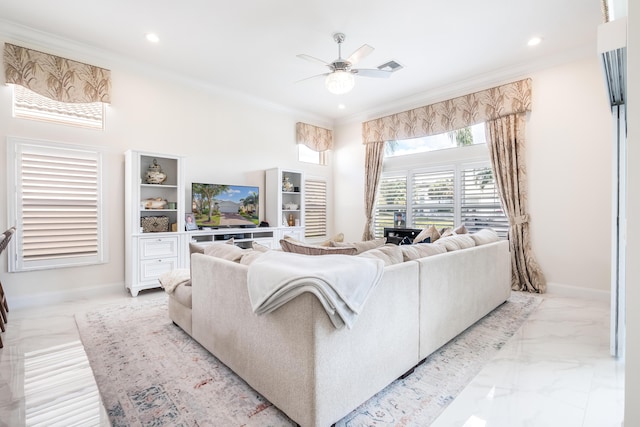 living room with ceiling fan and ornamental molding