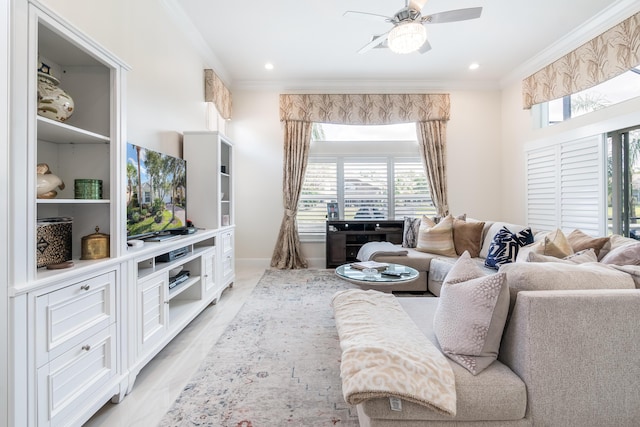 living room featuring ceiling fan, crown molding, and light hardwood / wood-style flooring