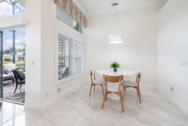 dining area with crown molding