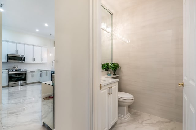 bathroom with backsplash, vanity, and crown molding