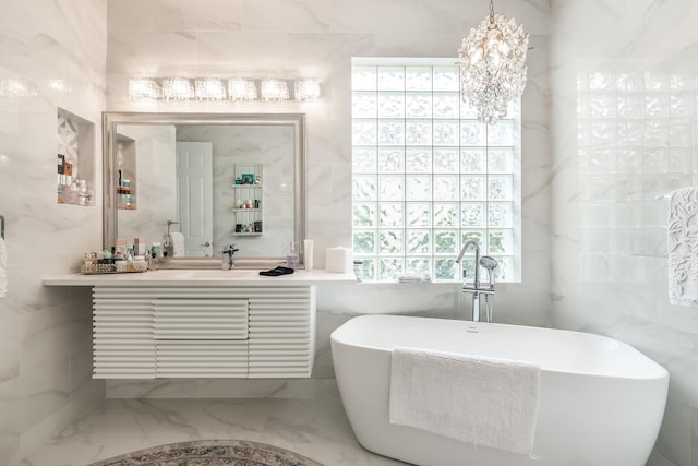 bathroom with vanity, a tub to relax in, and tile walls