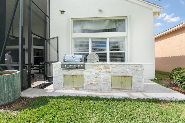 view of patio with grilling area and an outdoor kitchen