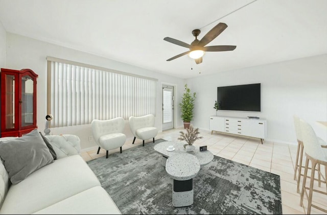 tiled living room with ceiling fan