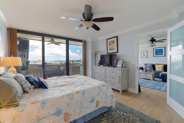 bedroom featuring ceiling fan, access to exterior, light wood-type flooring, and crown molding