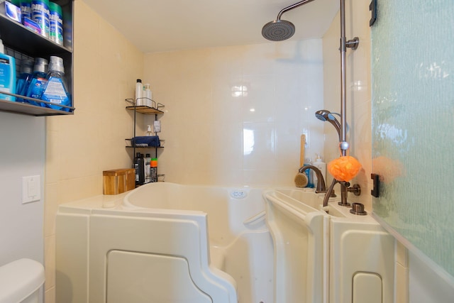 bathroom with a bathtub and toilet