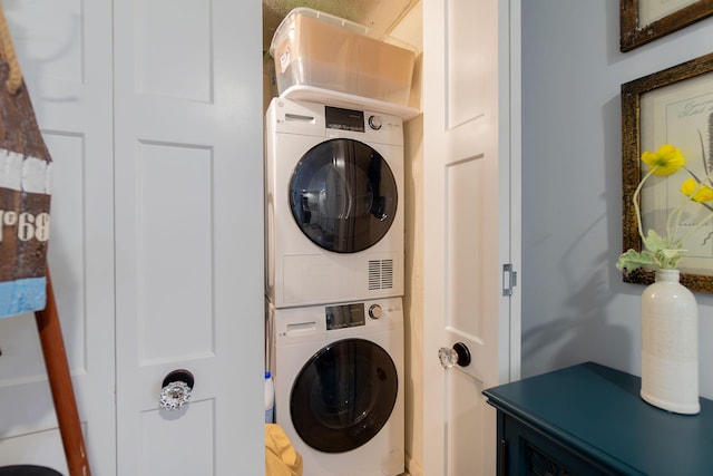 washroom with stacked washer and dryer