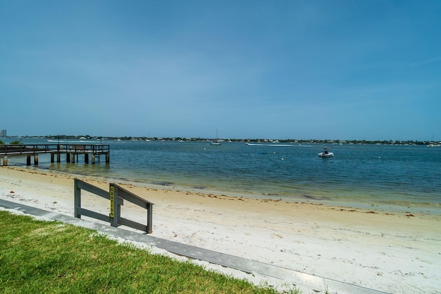 exterior space featuring a water view and a view of the beach