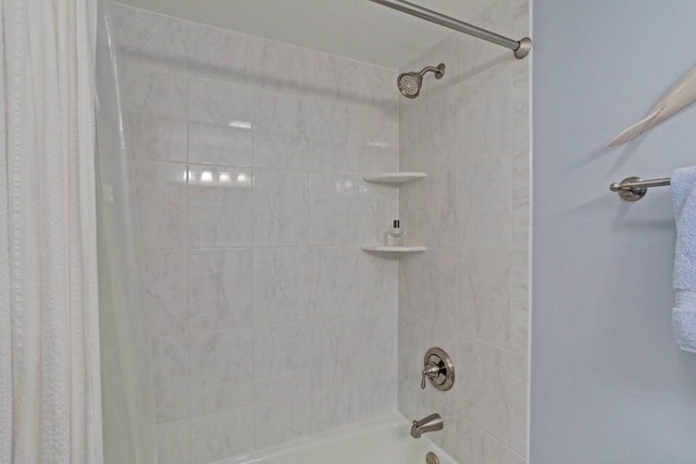 bathroom with shower / bath combination with curtain