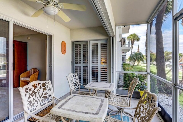 sunroom / solarium with ceiling fan