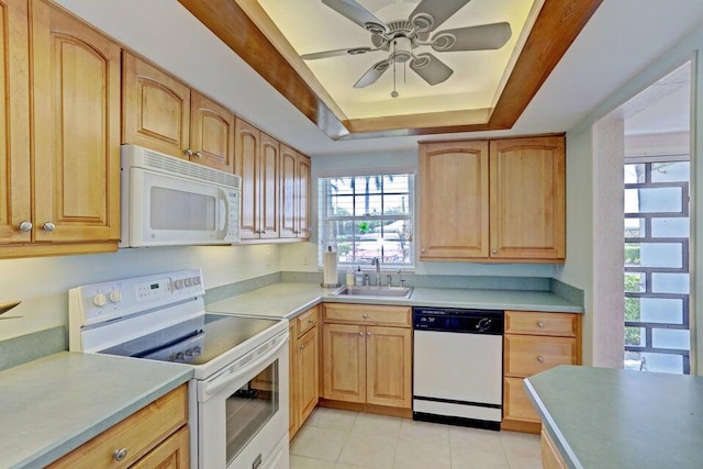 kitchen featuring white appliances, a raised ceiling, ceiling fan, sink, and light tile patterned floors