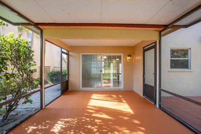 unfurnished sunroom featuring a healthy amount of sunlight