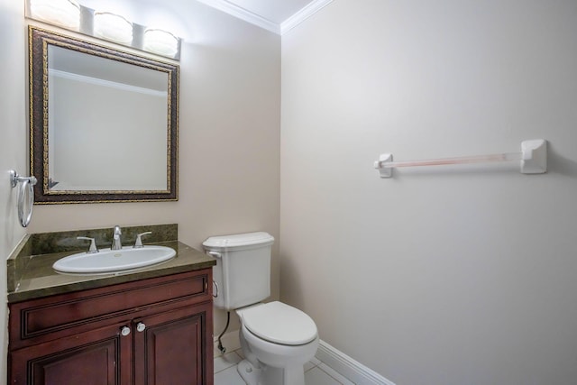 bathroom featuring tile patterned flooring, vanity, toilet, and ornamental molding