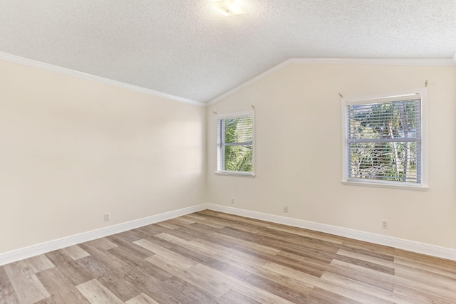 unfurnished room with light hardwood / wood-style floors and a textured ceiling