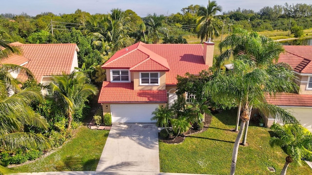 view of front of house featuring a front yard and a garage