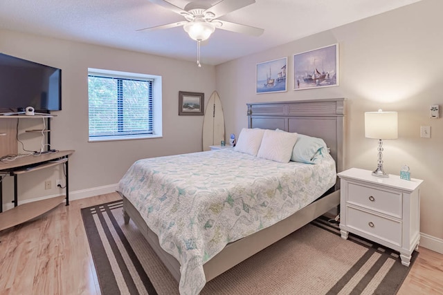 bedroom featuring ceiling fan and light hardwood / wood-style floors