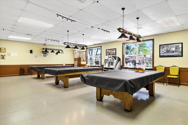 game room with a paneled ceiling, track lighting, and billiards