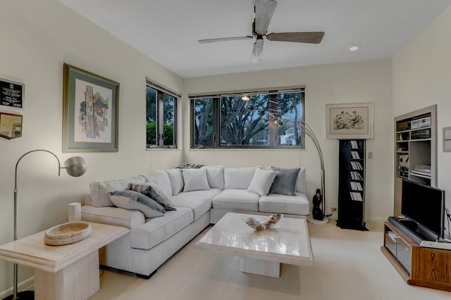 living room with ceiling fan and light carpet