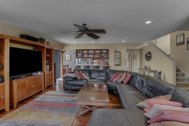 living room with ceiling fan and hardwood / wood-style floors