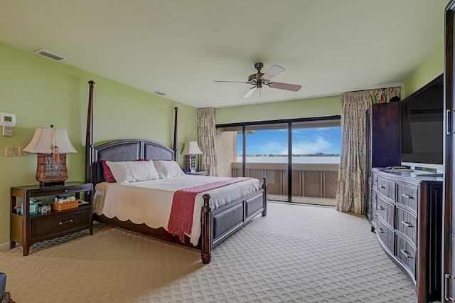 carpeted bedroom with ceiling fan and access to outside