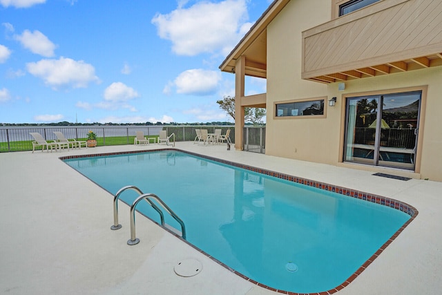 view of swimming pool featuring a patio area