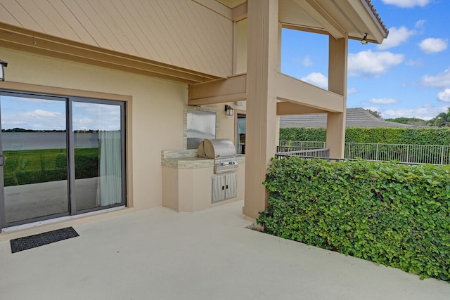 view of patio featuring a grill and exterior kitchen