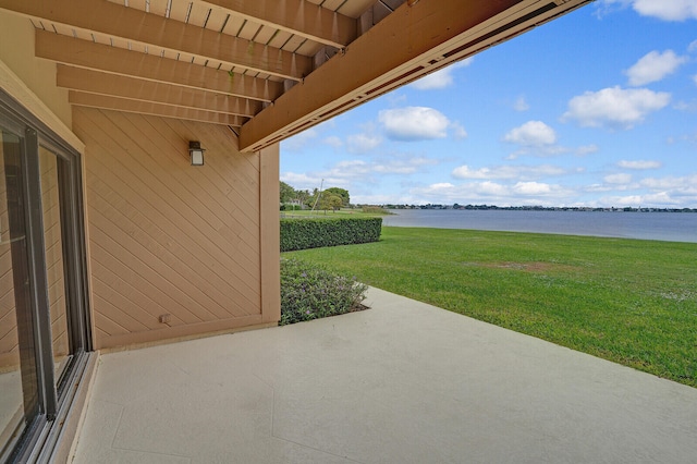 view of patio with a water view