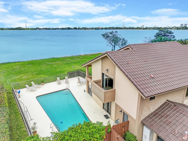 exterior space featuring a patio area and a water view