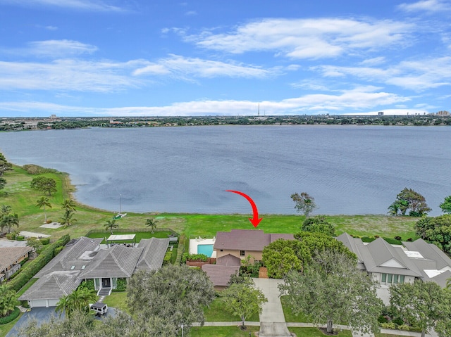 birds eye view of property with a water view