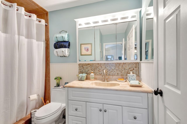 bathroom with vanity, toilet, and a shower with shower curtain