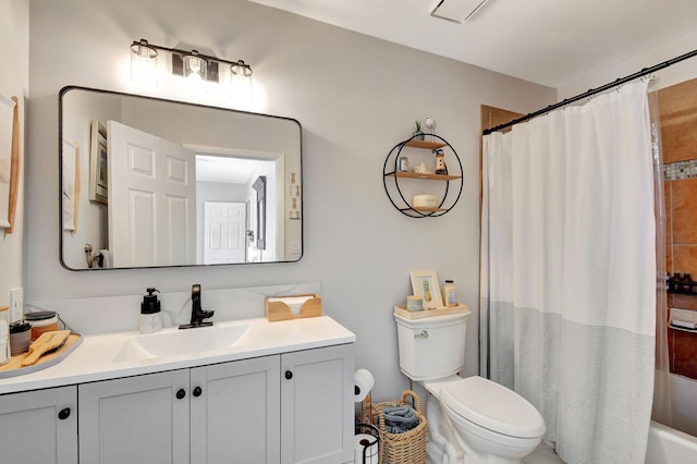 full bathroom featuring vanity, toilet, and shower / bath combo with shower curtain