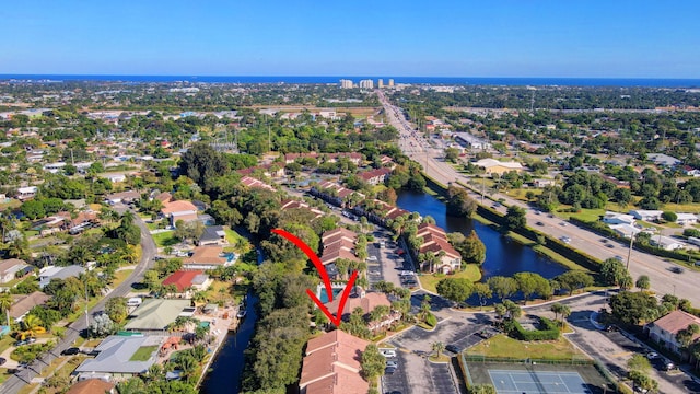 birds eye view of property with a water view