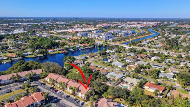 birds eye view of property featuring a water view