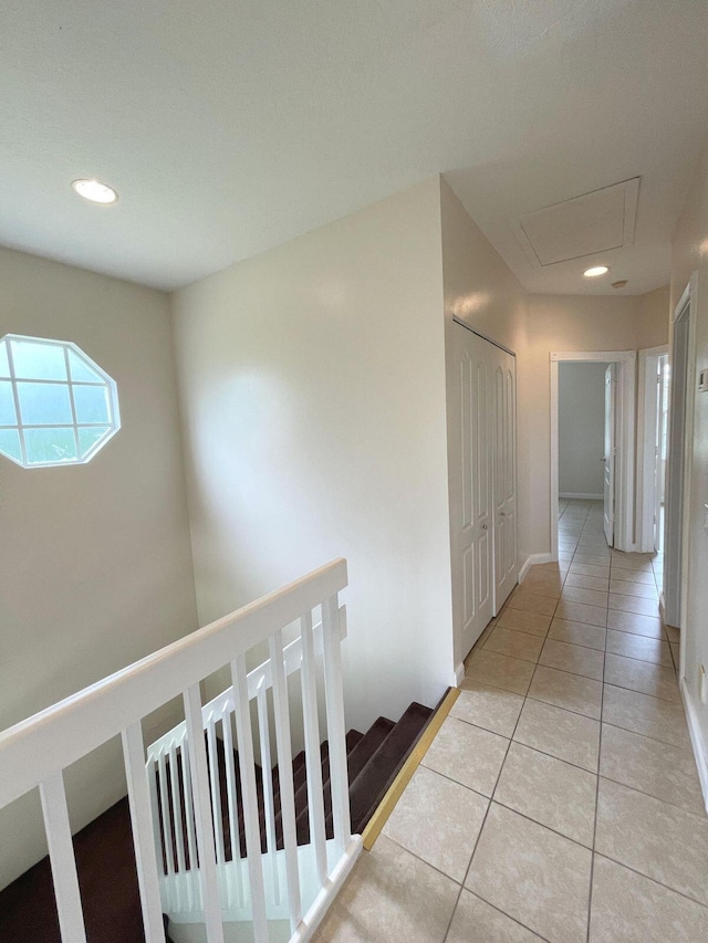 hallway featuring light tile patterned floors