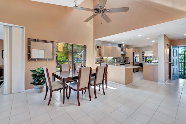 tiled dining area featuring ceiling fan