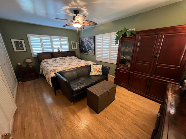 bedroom with ceiling fan and light wood-type flooring