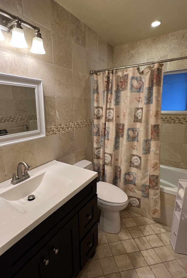 full bathroom with shower / bath combo, tile walls, vanity, tasteful backsplash, and toilet