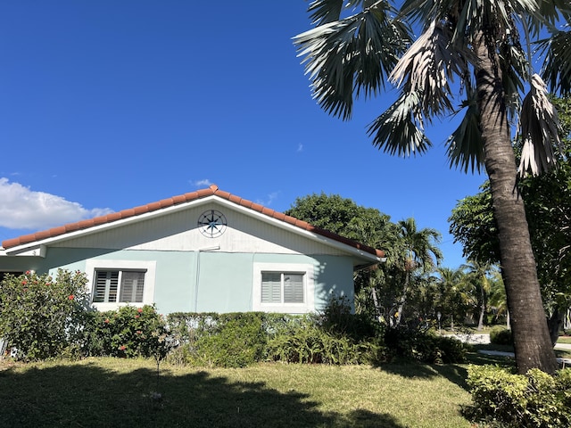 view of home's exterior featuring a yard