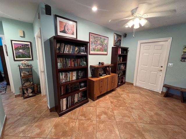 miscellaneous room with ceiling fan and light tile patterned flooring