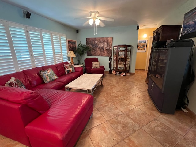 living room with light tile patterned floors and ceiling fan