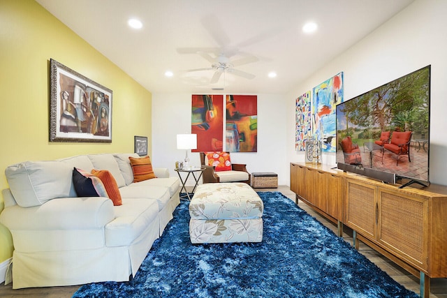 living room with ceiling fan and hardwood / wood-style floors